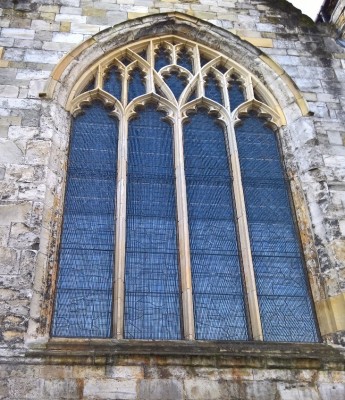 Figure 4: Exterior picture of stained-glass window of St. Denys church, with outlines of the images and protective casing visible (Author’s own, 2019)